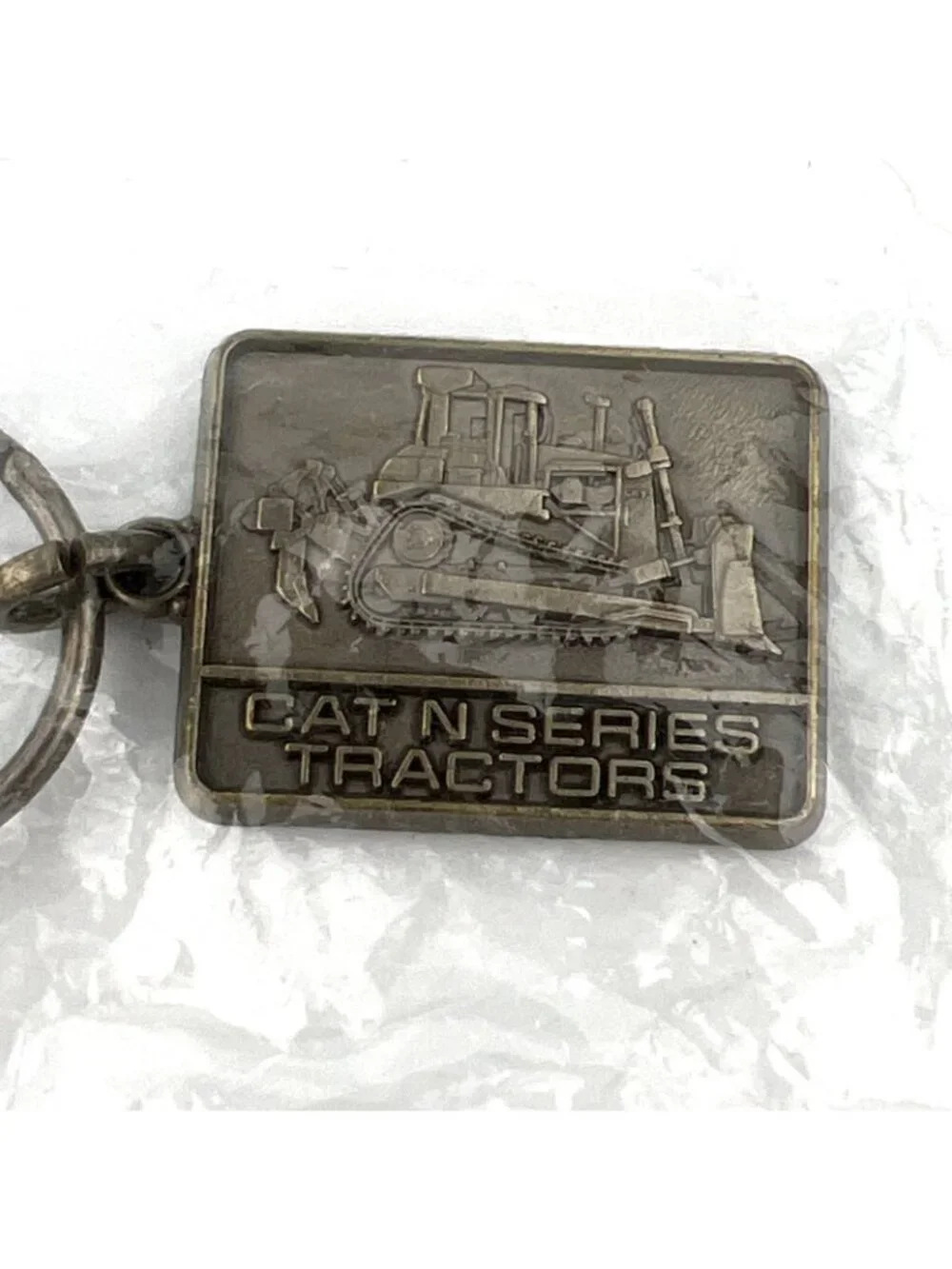 1986 Caterpillar Cat N Series Tractor Keyring Keychain NOS In original Package